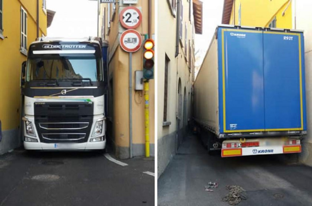 Un şofer profesionist român, blocat cu camionul pe o străduţă îngustă din Magnano